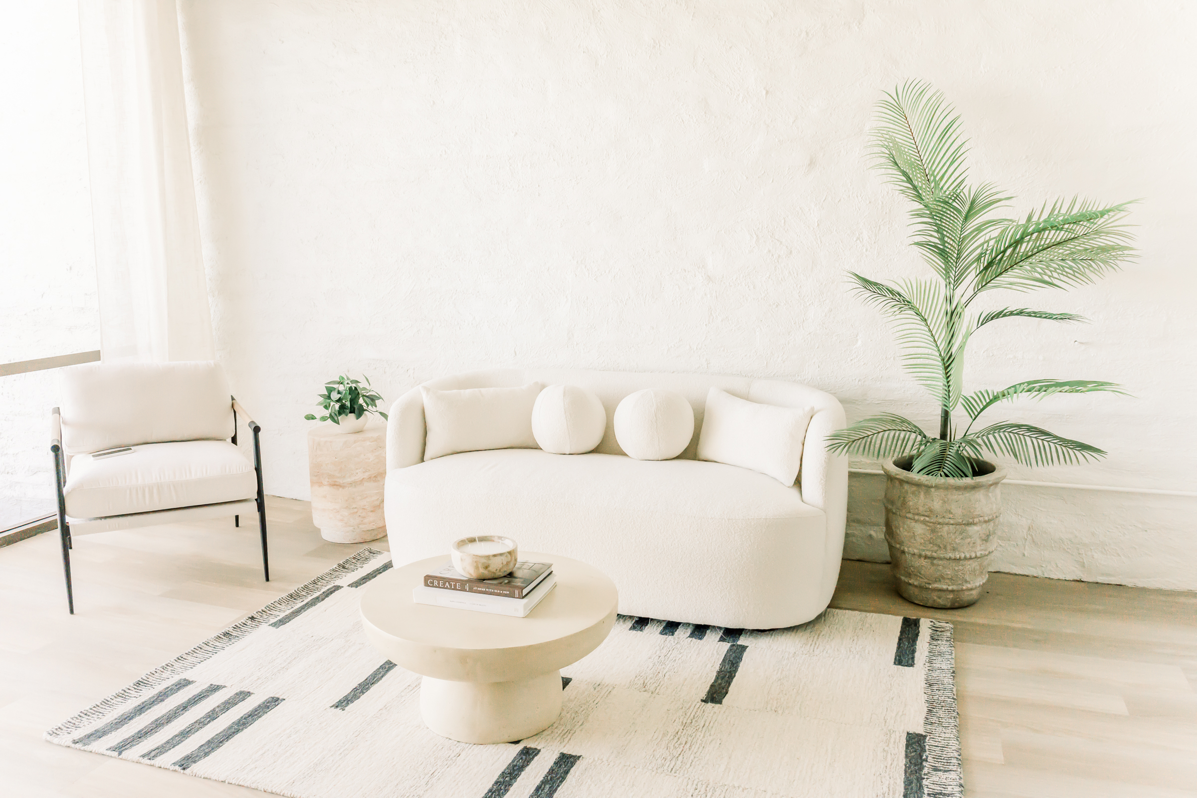 A luxurious sofa set inside the Orange County Boudoir studio, featuring an elegant and comfortable space designed for creating timeless boudoir portraits that highlight confidence, beauty, and self-expression.