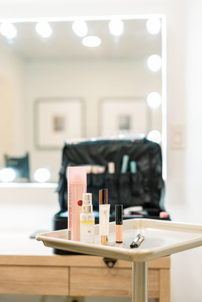 Luxury makeup essentials and beauty tools prepared for a boudoir session at Orange County Boudoir.